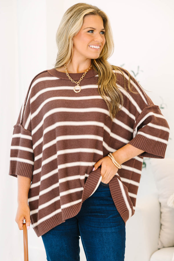 Plus Size brown and white horizontal striped oversized sweater with elbow-length sleeves.