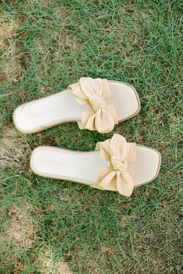 Natural raffia slide sandals with oversized sculptural bows 