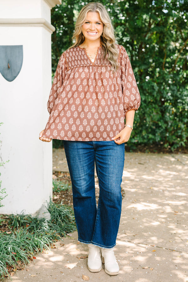 Plus Size brown floral print top with smocked yoke, V-neckline, and balloon sleeves.