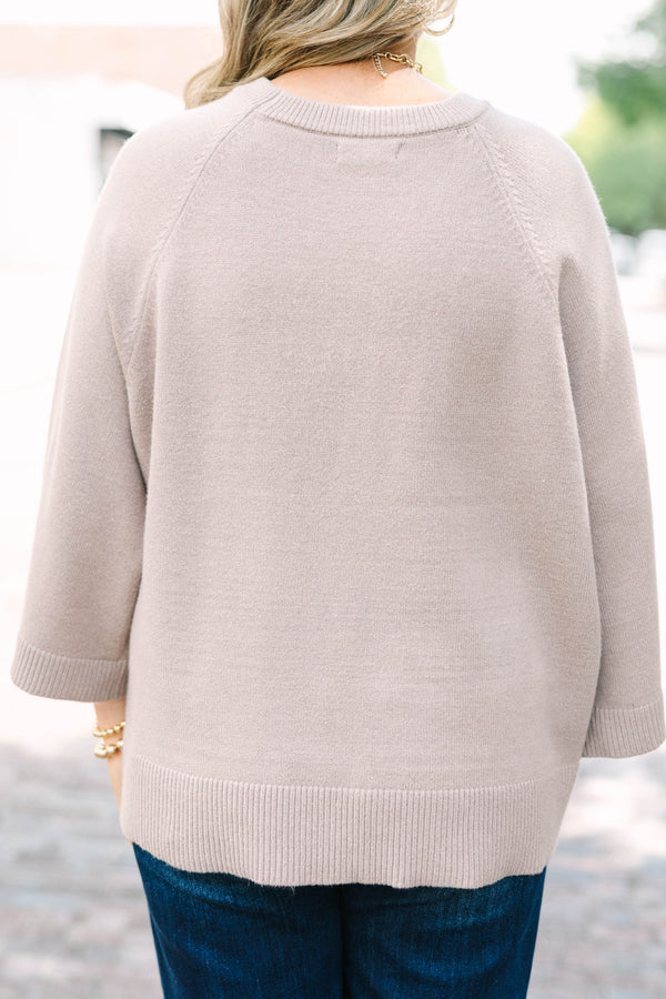 Plus size light mocha raglan sweater with a relaxed fit, crew neck, and flowy elbow-length sleeves.