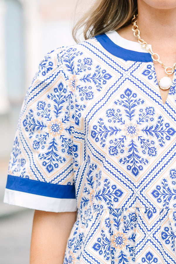 Plus Size blue and white tile print babydoll dress with a v-neckline and short sleeves.