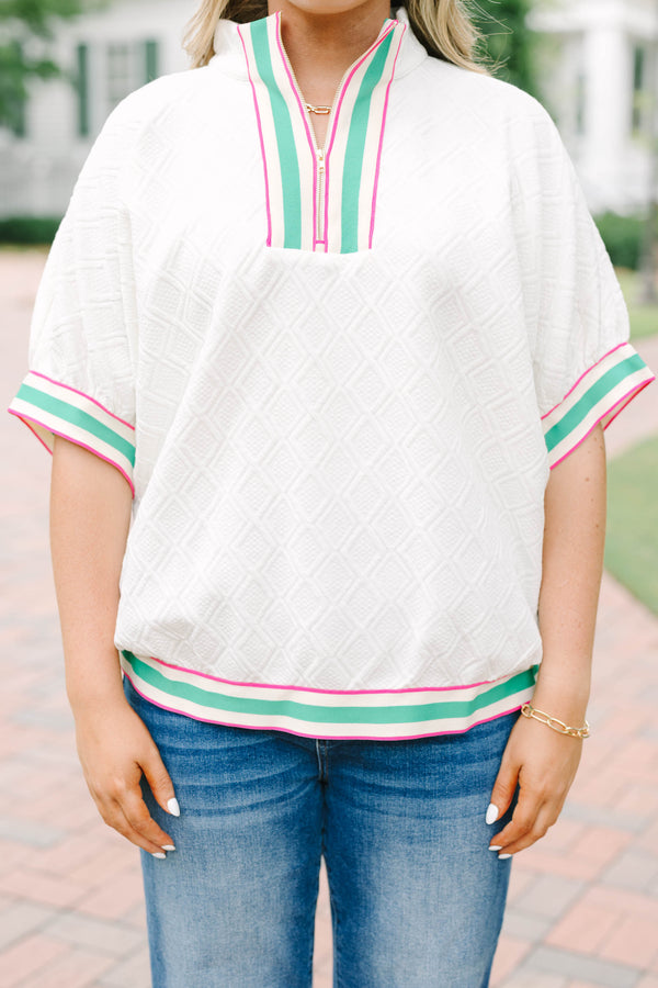 Plus size half zip top with textured fabric and pink/green contrast on hem, sleeves and neckline