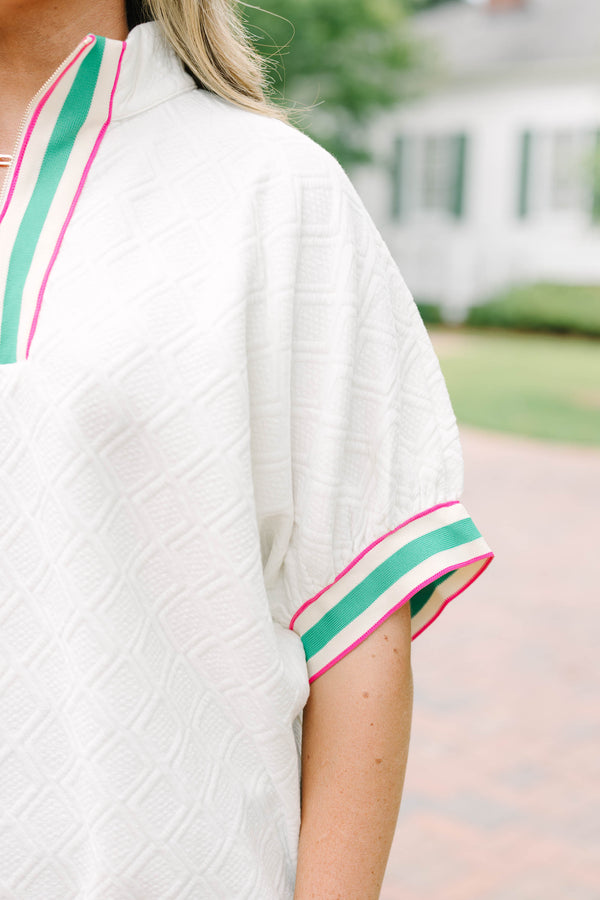 Plus size half zip top with textured fabric and pink/green contrast on hem, sleeves and neckline