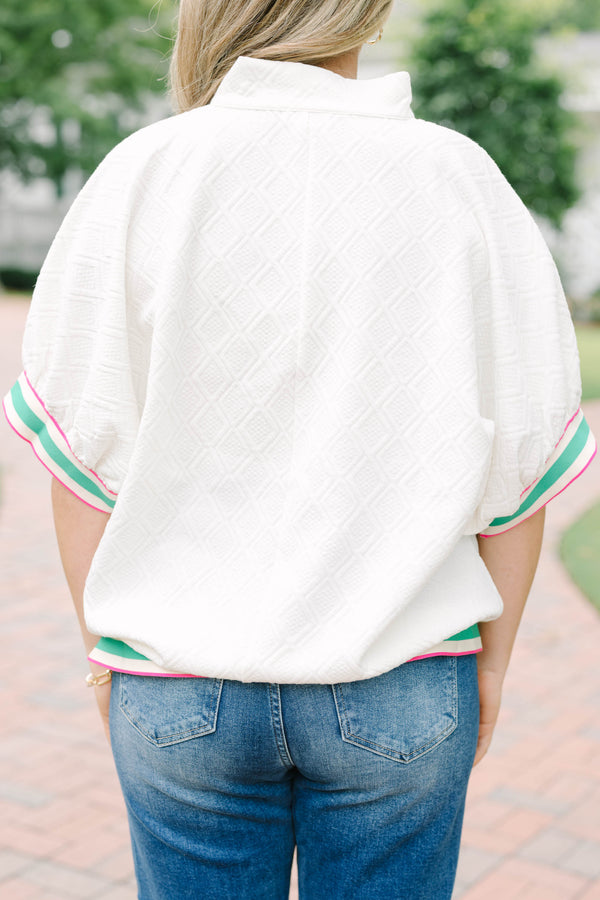 Plus size half zip top with textured fabric and pink/green contrast on hem, sleeves and neckline
