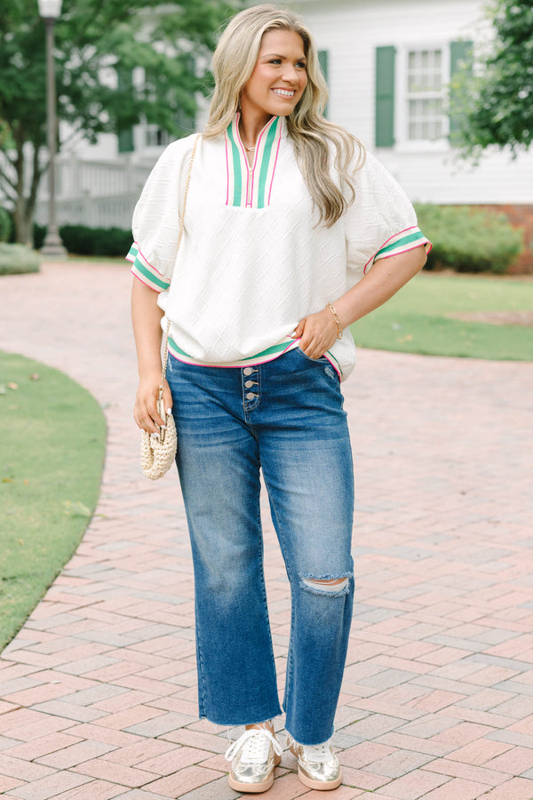 Plus size half zip top with textured fabric and pink/green contrast on hem, sleeves and neckline