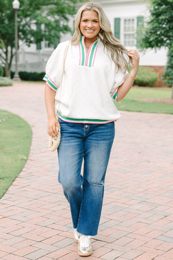 Plus size half zip top with textured fabric and pink/green contrast on hem, sleeves and neckline