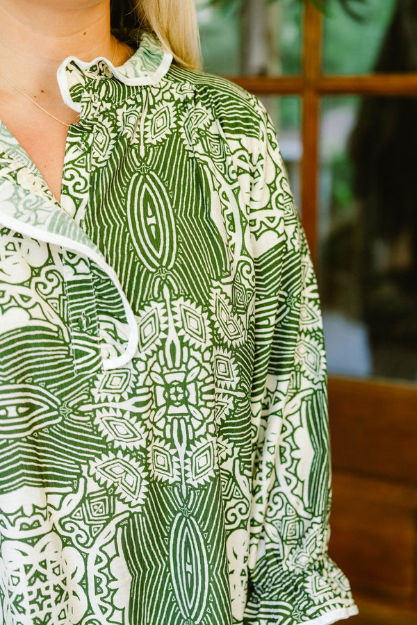 Chic Soul plus size clothing, green and white abstract print long sleeve top with a slight v neckline and ruffle detailing around the neckline and sleeves