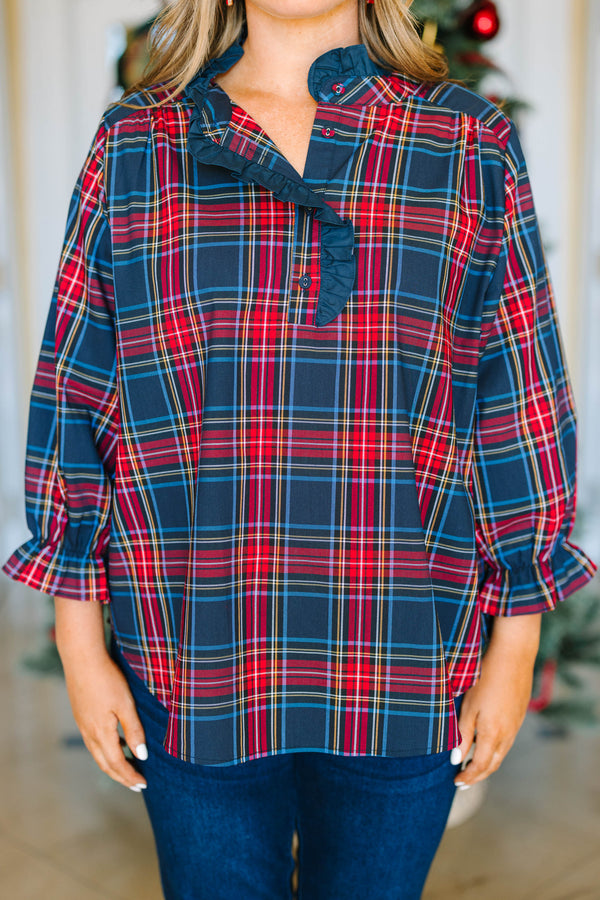 Plus Size navy plaid top with a ruffled collar, button neckline, and long sleeves with ruffle cuffs.