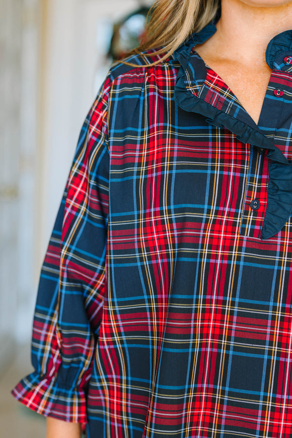 Plus Size navy plaid top with a ruffled collar, button neckline, and long sleeves with ruffle cuffs.