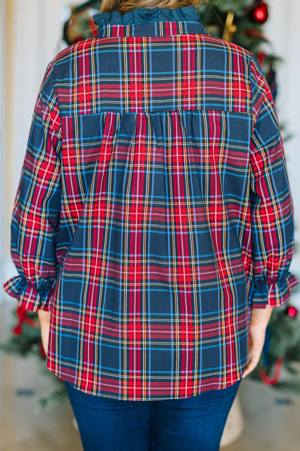 Plus Size navy plaid top with a ruffled collar, button neckline, and long sleeves with ruffle cuffs.