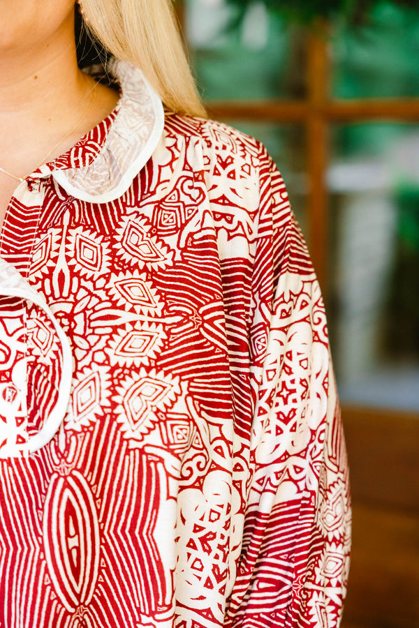 Chic Soul plus size clothing, red and cream abstract pattern long sleeve blouse with ruffle on the collar and end of the sleeves
