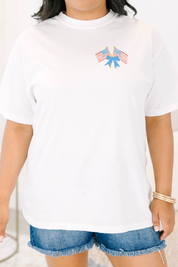 Plus Size white vintage wash tee with a small American flag and blue bow graphic on the upper right chest and a back graphic of American flags and blue stripes.