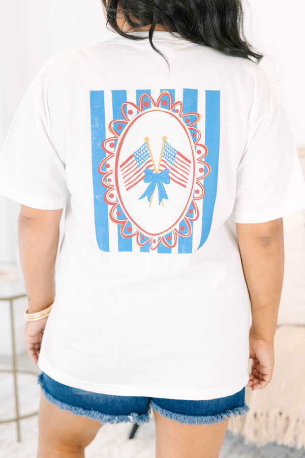 Plus Size white vintage wash tee with a small American flag and blue bow graphic on the upper right chest and a back graphic of American flags and blue stripes.
