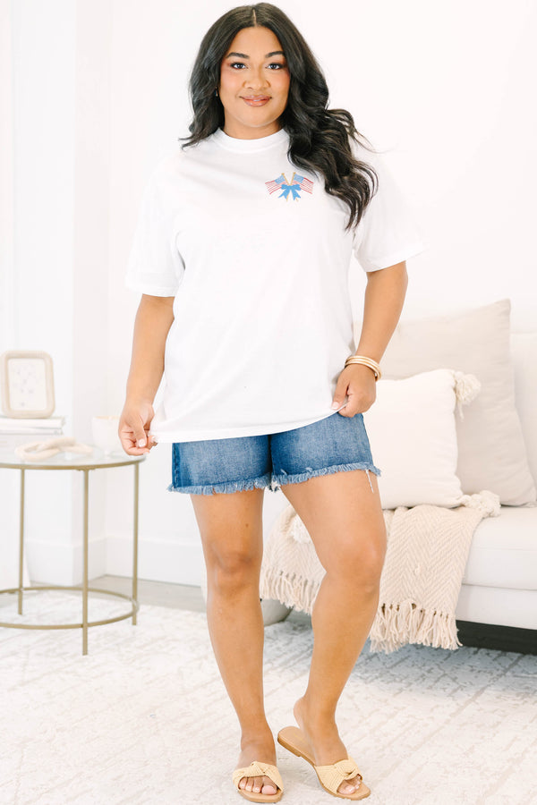 Plus Size white vintage wash tee with a small American flag and blue bow graphic on the upper right chest and a back graphic of American flags and blue stripes.