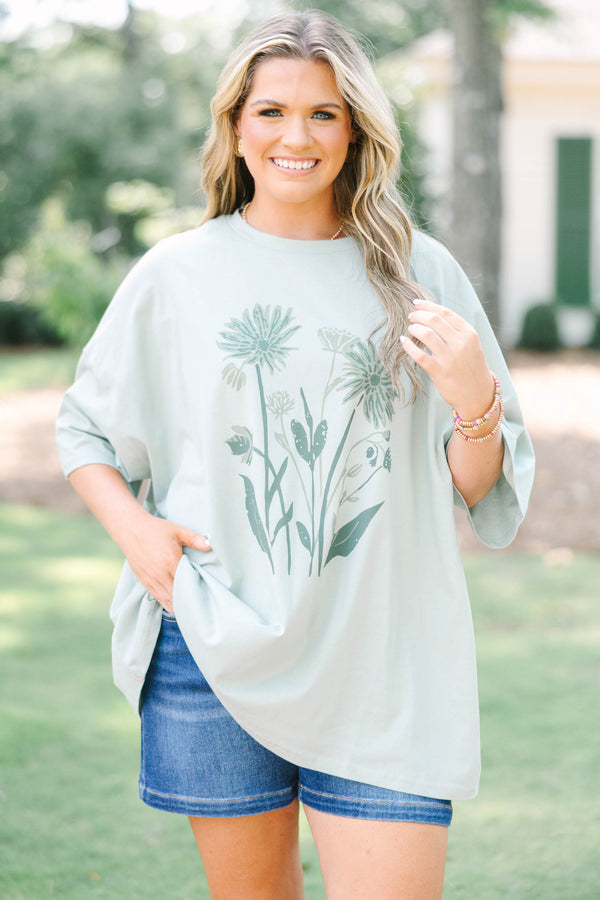 Plus Size light sage boyfriend tee with a dark green floral garden graphic 