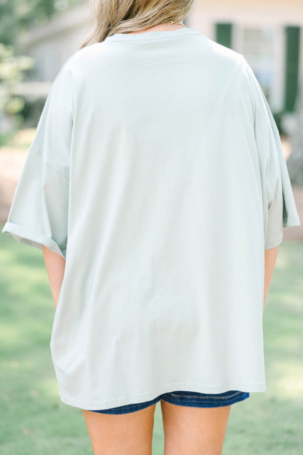 Plus Size light sage boyfriend tee with a dark green floral garden graphic 