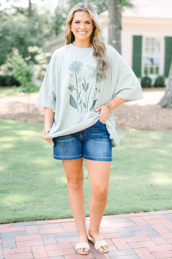 Plus Size light sage boyfriend tee with a dark green floral garden graphic 