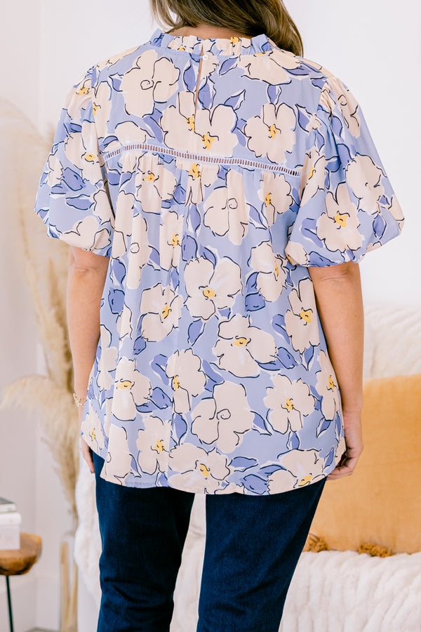 Chic Soul plus size clothing, short-puffed-sleeve periwinkle blue top with a ruffled mock neckline and a tan and blue floral watercolor pattern 