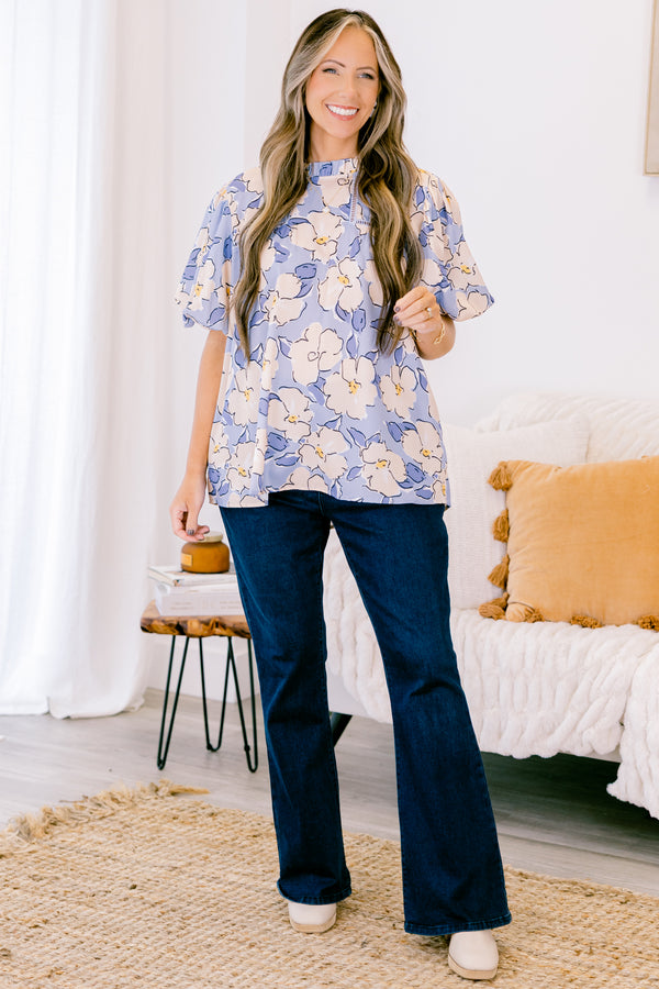 Chic Soul plus size clothing, short-puffed-sleeve periwinkle blue top with a ruffled mock neckline and a tan and blue floral watercolor pattern 