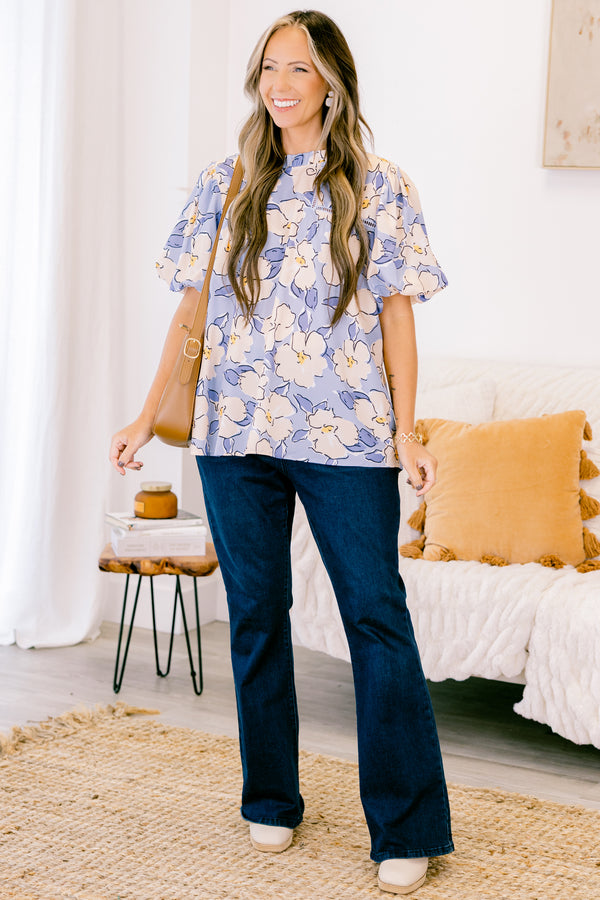 Chic Soul plus size clothing, short-puffed-sleeve periwinkle blue top with a ruffled mock neckline and a tan and blue floral watercolor pattern 