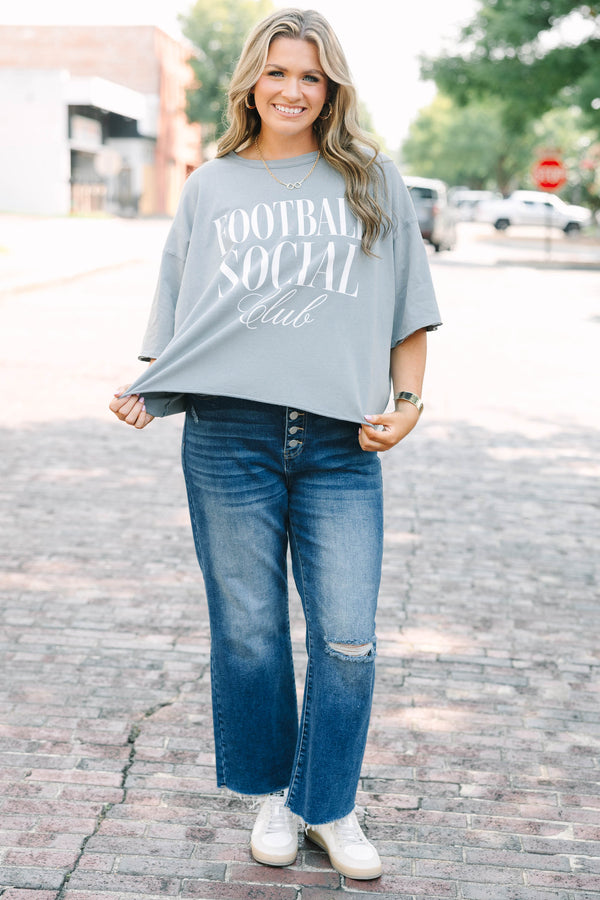 Plus Size steel blue vintage wash tee with Football Social Club graphic and unfinished hems.