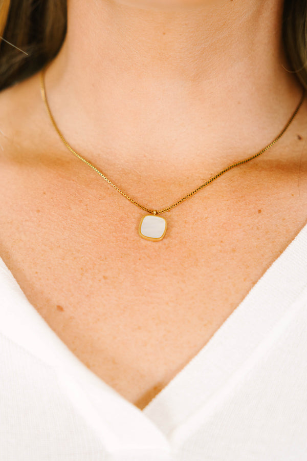 Gold box chain necklace featuring a square white mother of pearl pendant.