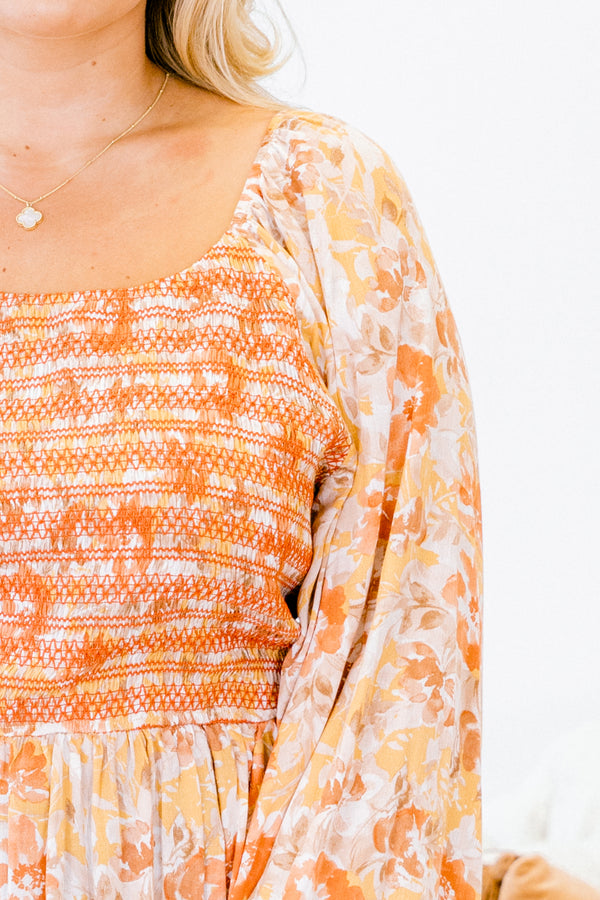 Chic Soul plus size clothing, multi-color orange top with long bubble sleeves and floral pattern as well as stitching details on the chest 