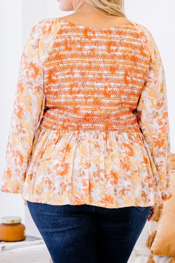 Chic Soul plus size clothing, multi-color orange top with long bubble sleeves and floral pattern as well as stitching details on the chest 