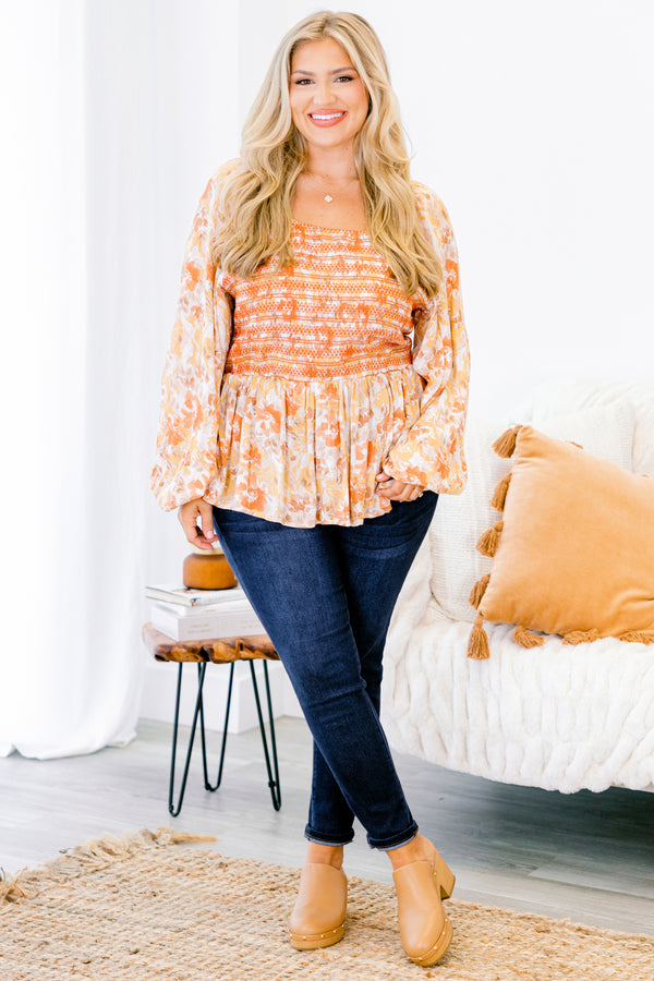 Chic Soul plus size clothing, multi-color orange top with long bubble sleeves and floral pattern as well as stitching details on the chest 