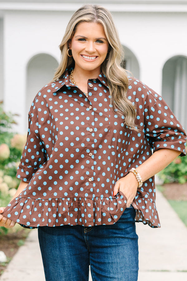 Plus Size brown button-down top with blue polka dots, short sleeves, and a ruffled hem.
