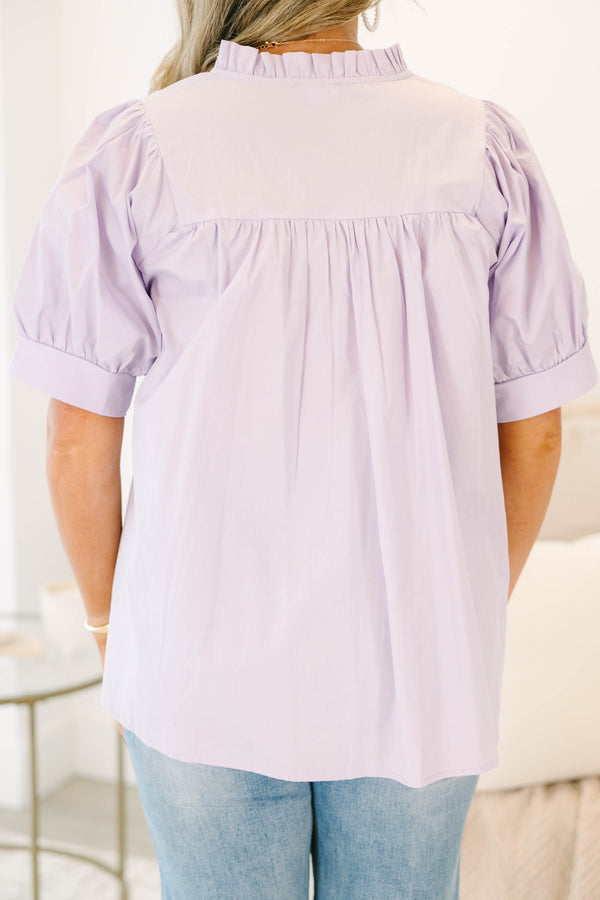 Plus Size lavender babydoll top with puff sleeves, a ruffled split neckline, and pleated bodice.