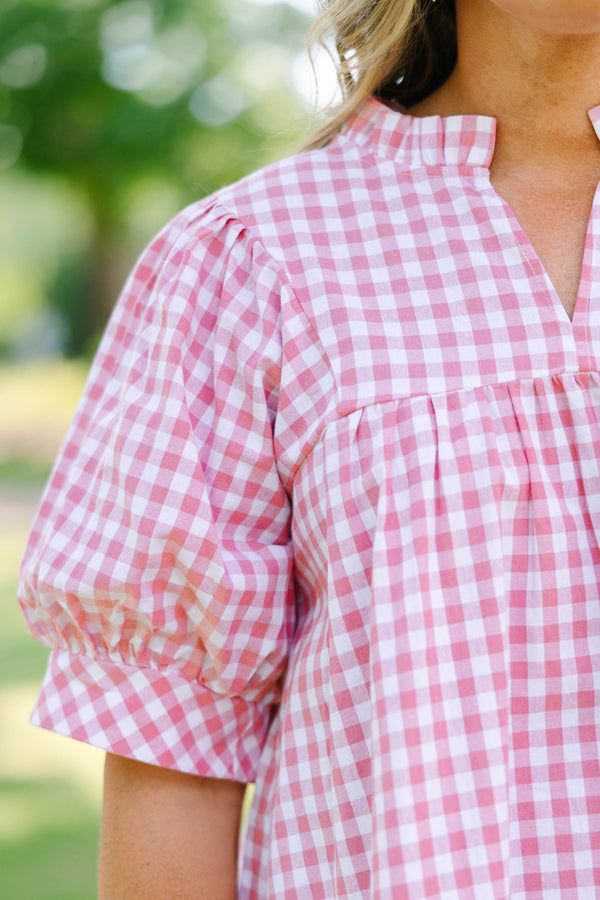 Plus Size pink and white gingham top featuring a split neckline and voluminous puff sleeves.