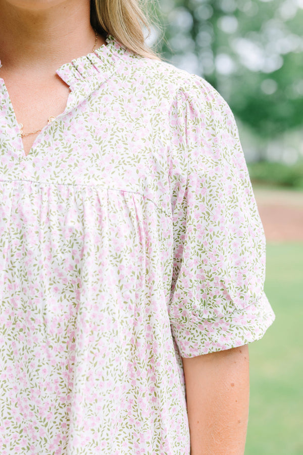 Plus Size pink and green floral print babydoll top with puff sleeves and a split neckline.