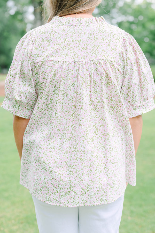 Plus Size pink and green floral print babydoll top with puff sleeves and a split neckline.