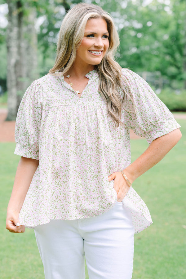 Plus Size pink and green floral print babydoll top with puff sleeves and a split neckline.