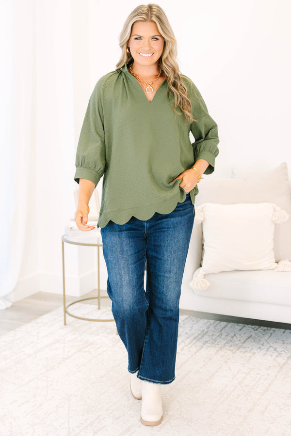 Plus Size olive textured v-neck top with three-quarter puff sleeves and a scalloped hem.