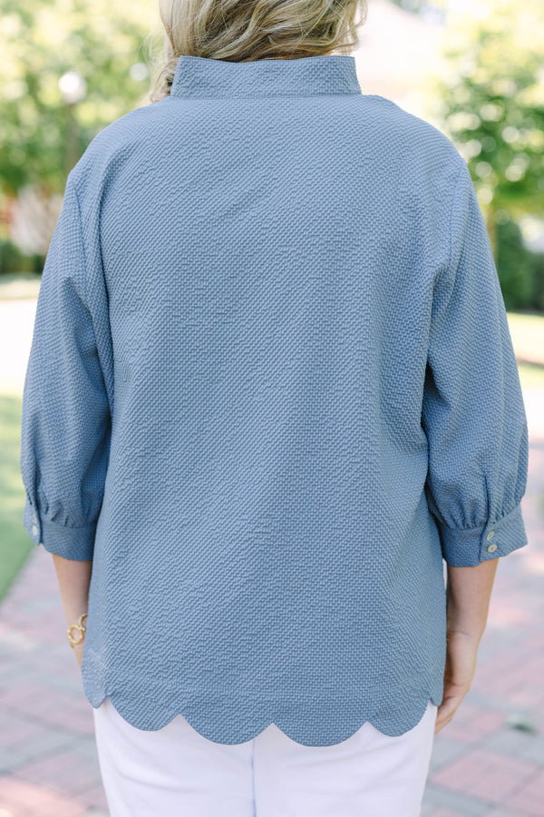 Plus Size steel blue textured top with a V-neckline and three-quarter length puff sleeves.