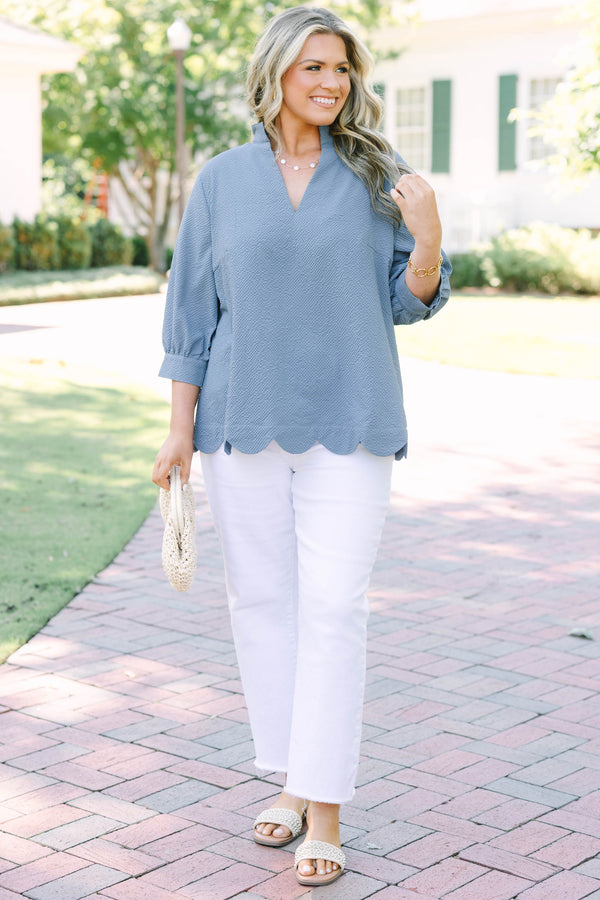 Plus Size steel blue textured top with a V-neckline and three-quarter length puff sleeves.