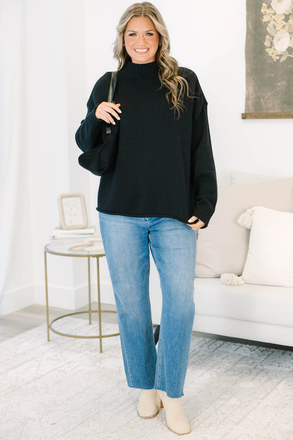 Plus Size black rollneck sweater with a relaxed fit, long sleeves, and ribbed knit details.