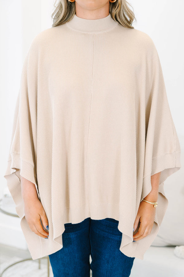Plus Size taupe ribbed knit poncho with a mock neckline and wide, draped sleeves.
