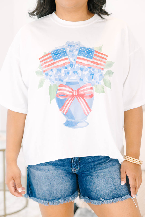 Plus Size white vintage wash tee with a hydrangea and American flag graphic and raw hems.