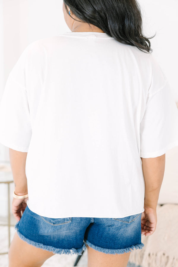 Plus Size white vintage wash tee with a hydrangea and American flag graphic and raw hems.