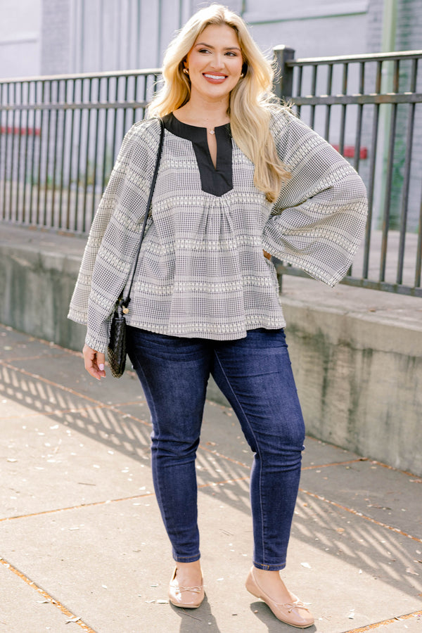 Chic Soul plus size clothing, black plaid top with long flowy sleeves and a thick black detail going along the v-neckline 