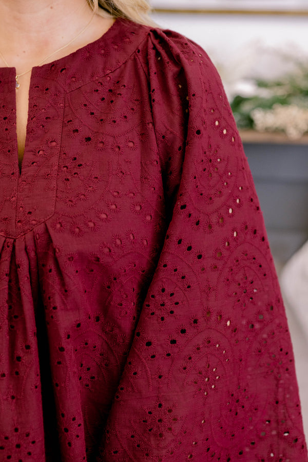 Chic Soul plus size clothing, dark red long bell sleeve top with lace eyelet detailing and a v cutout on the neckline 