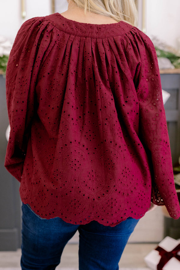 Chic Soul plus size clothing, dark red long bell sleeve top with lace eyelet detailing and a v cutout on the neckline 