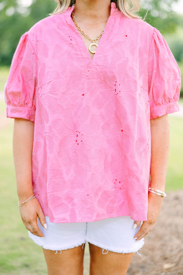 Plus Size pink eyelet top with puff sleeves, a split neckline, and white denim shorts.