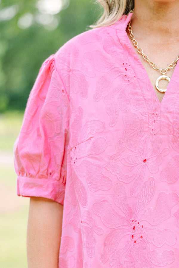 Plus Size pink eyelet top with puff sleeves, a split neckline, and white denim shorts.