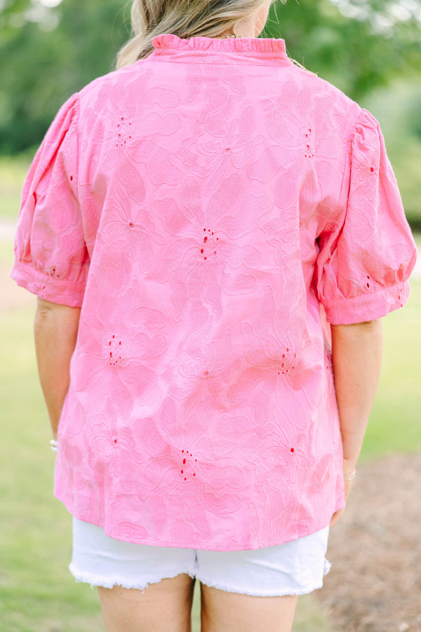 Plus Size pink eyelet top with puff sleeves, a split neckline, and white denim shorts.