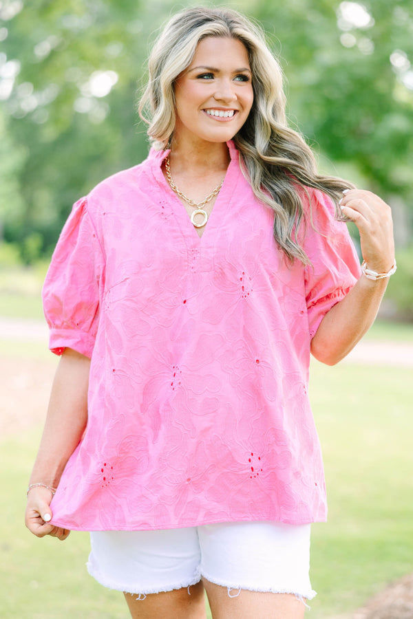 Plus Size pink eyelet top with puff sleeves, a split neckline, and white denim shorts.