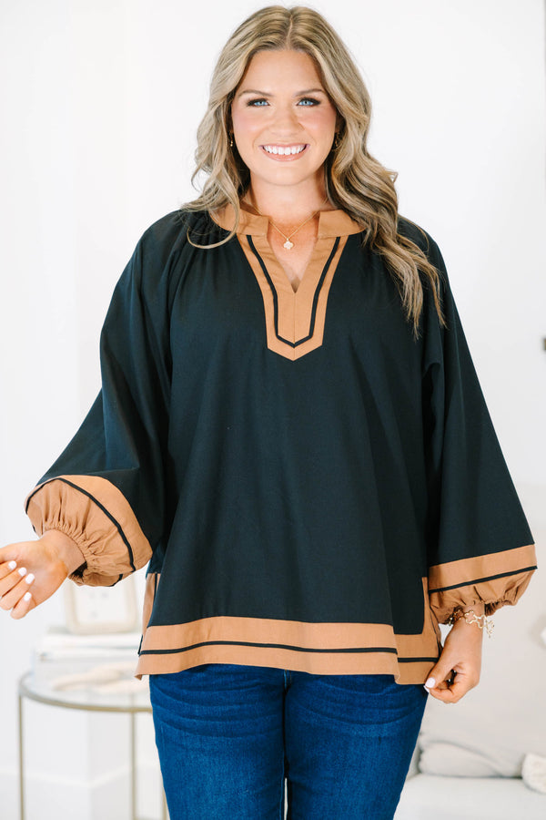 Plus Size black tunic top with tan trim, V-neckline, and long balloon sleeves.